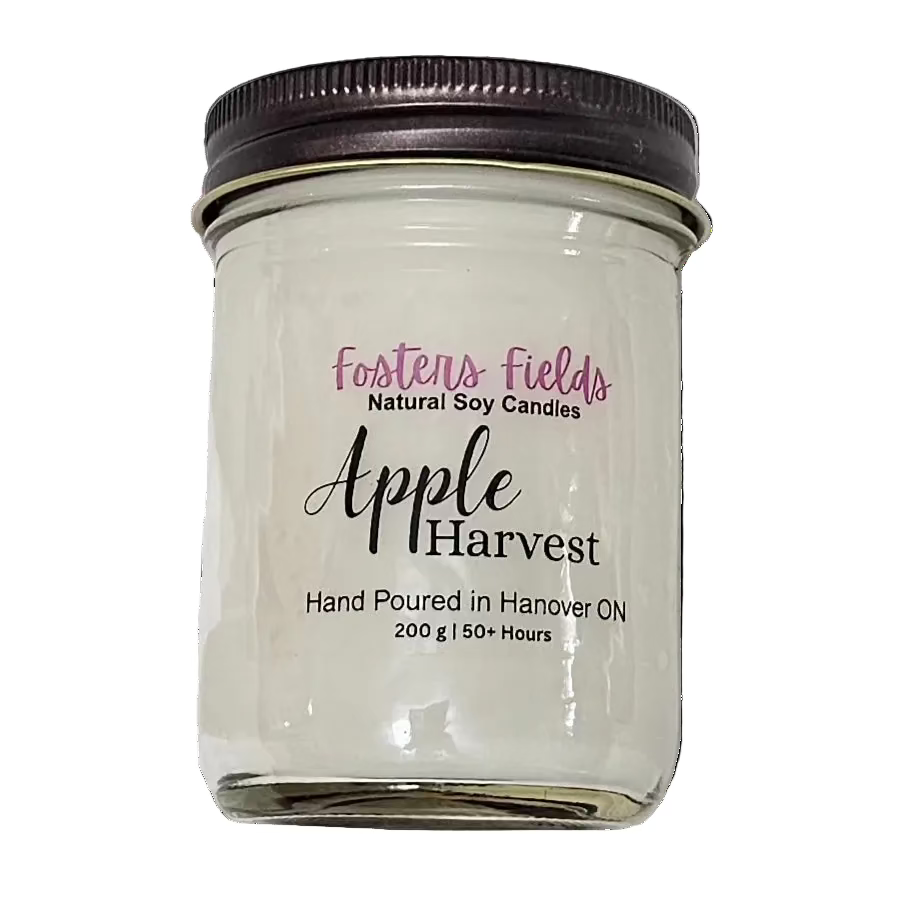 White soy wax poured in a jam jar with a copper lid, simple clear label for Apple Harvest scented candle