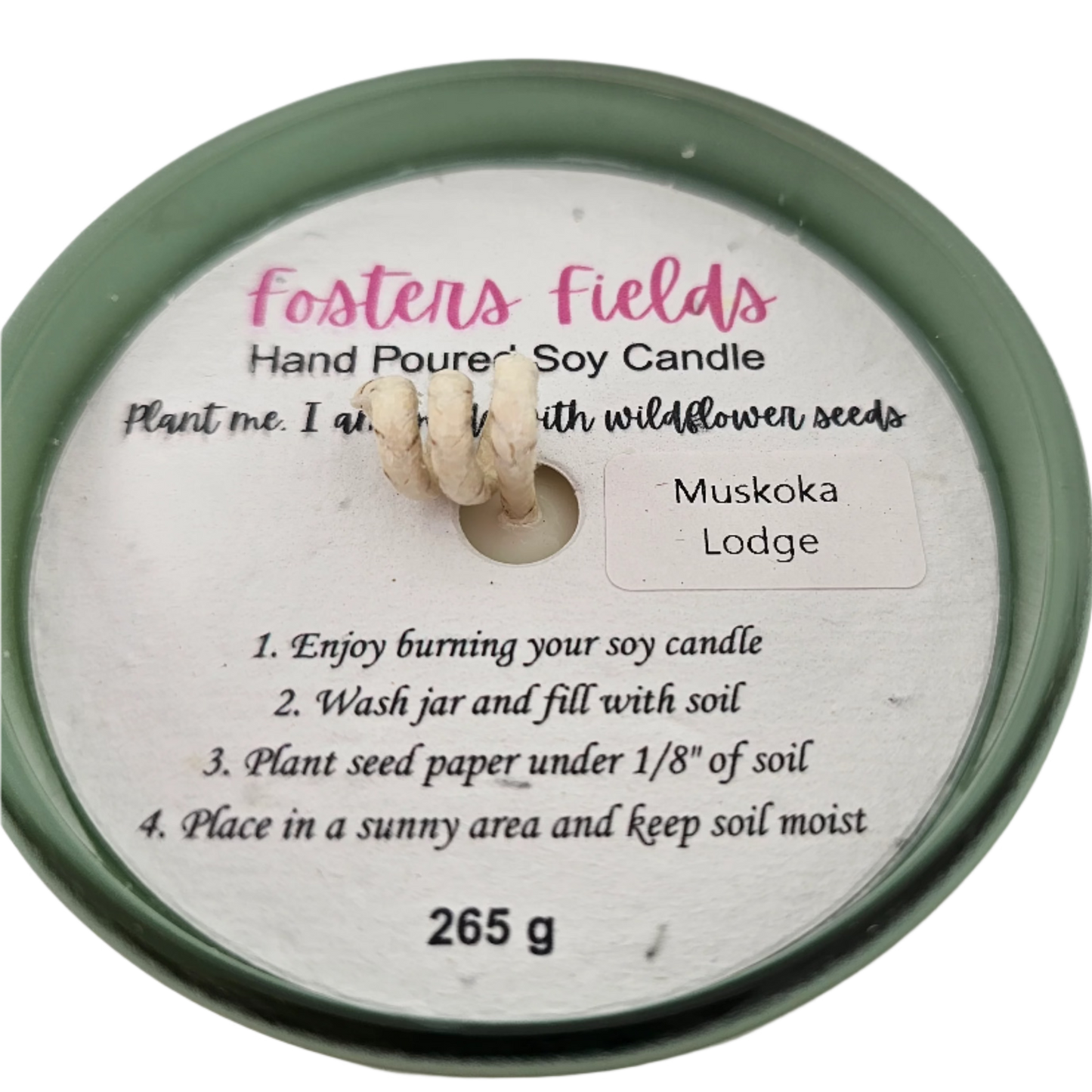 Handmade soy candle in a green jar, capturing the essence of a Muskoka lakeside lodge