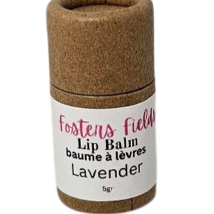 A small, cylindrical container of lavender lip balm with a label that reads 'Fosters Field' and 'Lavender 5g'.