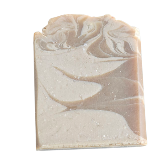 Handmade soap bar with natural marbled pattern on a white background