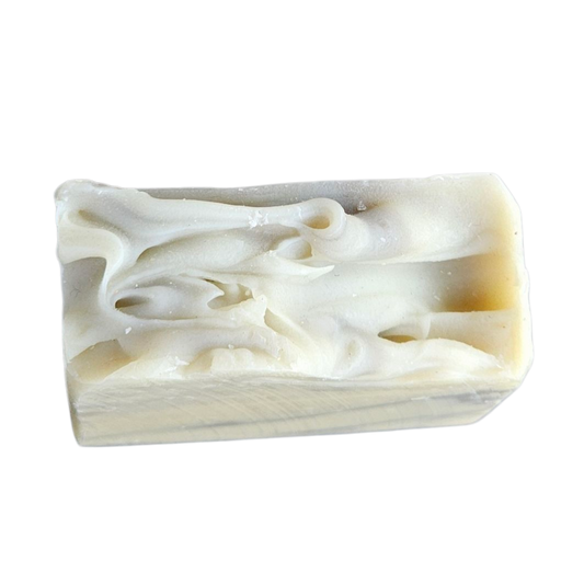 Bar of soap with swirl pattern on a white background, top view of Bergamot Patchouli handmade soap