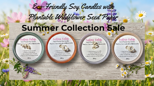 Four colorful matte glass jar soy candles from FostersFields Plant Me collection arranged on a light wood surface, each topped with a wildflower seed paper dust cover.