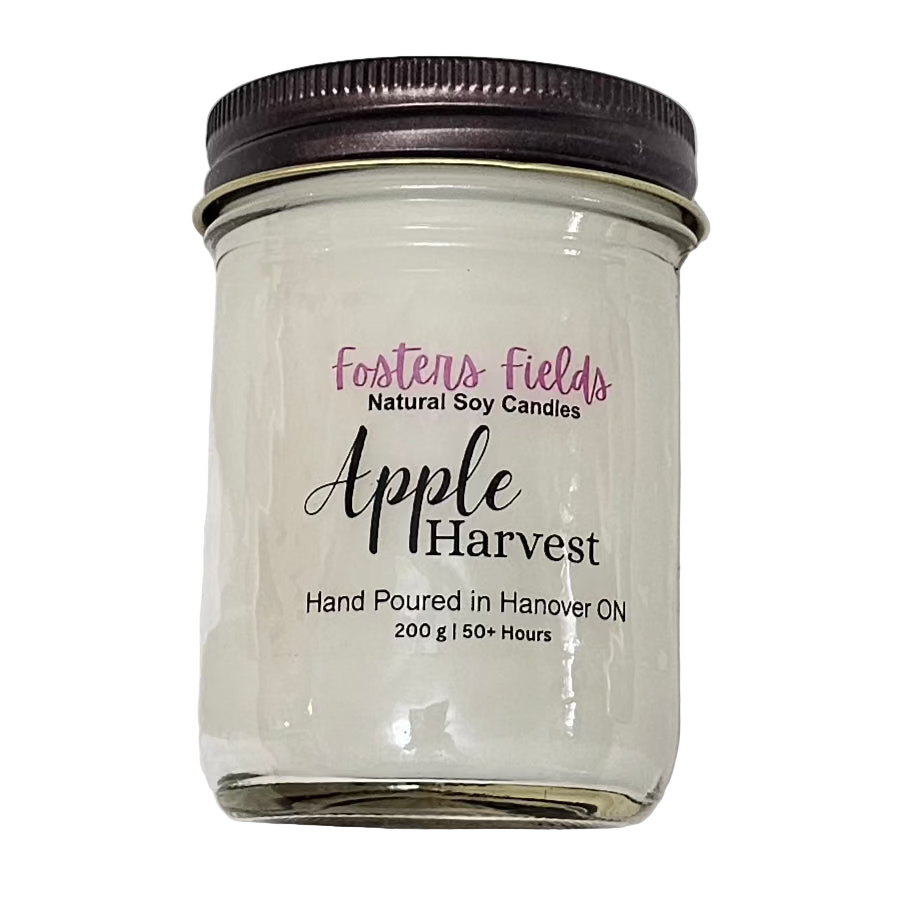 White soy wax poured in a jam jar with a copper lid, simple clear label for Apple Harvest scented candle