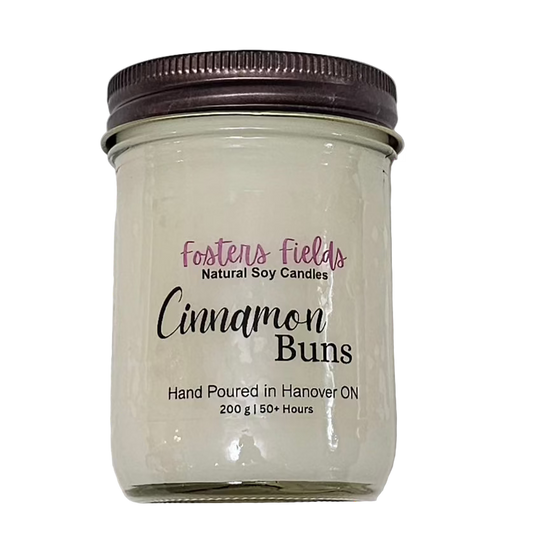 white soy wax poured into a jam jar with a copper lid, cinnamon buns scent, clear simple label