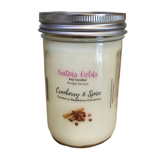 White soy wax, scented with Cranberry Spice and poured into a 8oz glass jar. A clear label displaying the candle information