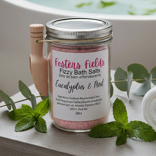 Jar of Fosters Fields Fizzy Bath Salts with Eucalyptus & Mint on a white surface