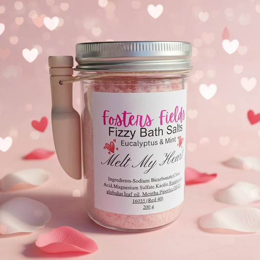Jar of Fizzy Bath Salts by Fosters Fields, pink product, simple white label, scoop hanging on the side