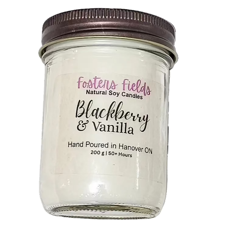 soy candle, poured in a jam jar, coppe lid with a simple clear label from Fosters Fields. Blackberry Vanilla Scent. White soy wax