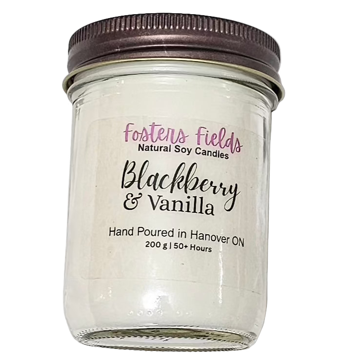 soy candle, poured in a jam jar, coppe lid with a simple clear label from Fosters Fields. Blackberry Vanilla Scent. White soy wax