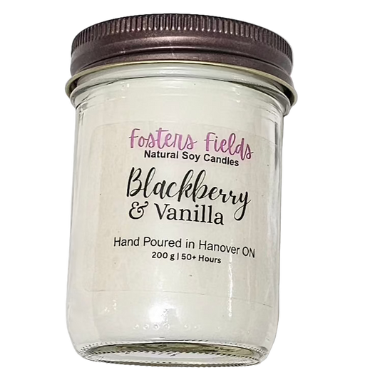 soy candle, poured in a jam jar, coppe lid with a simple clear label from Fosters Fields. Blackberry Vanilla Scent. White soy wax