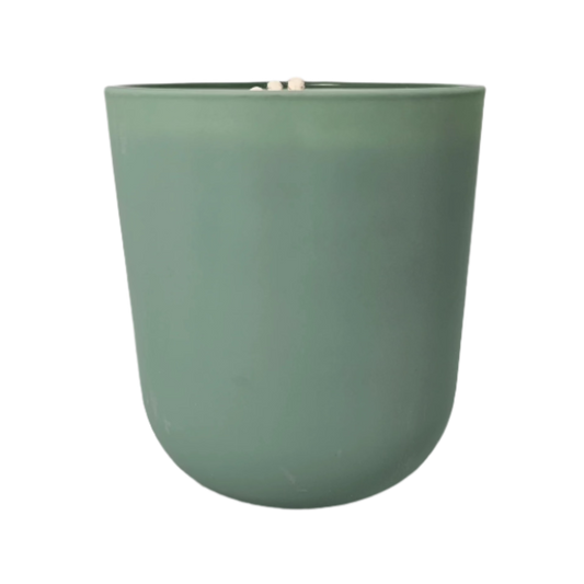 Earthy soy candle in green glass jar, inspired by the serene Muskoka wilderness

