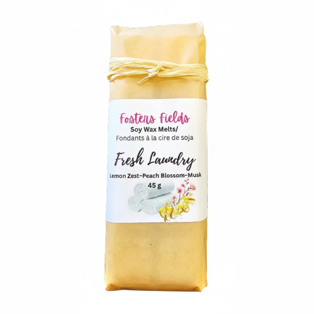 Soy wax melt package labeled 'Foster's Fields Fresh Laundry' on a white surface.