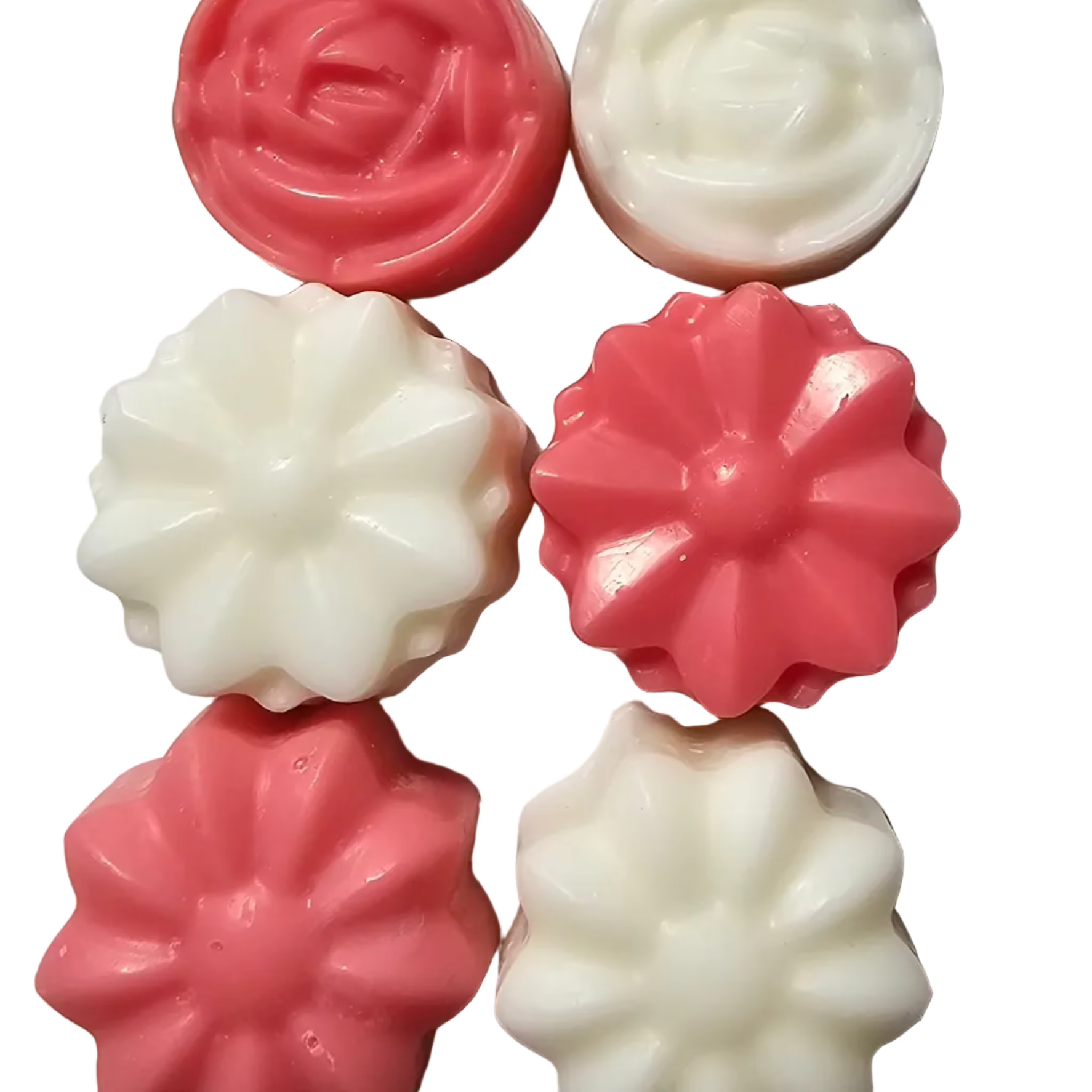 Pink and white floral-shaped wax melts on a light gray background