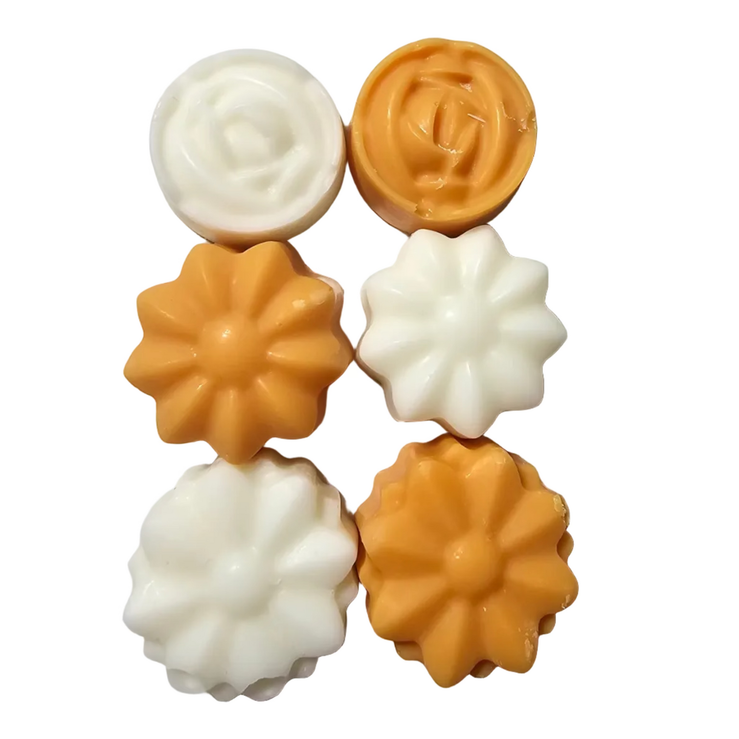 Decorative wax melts shaped like flowers on a white surface