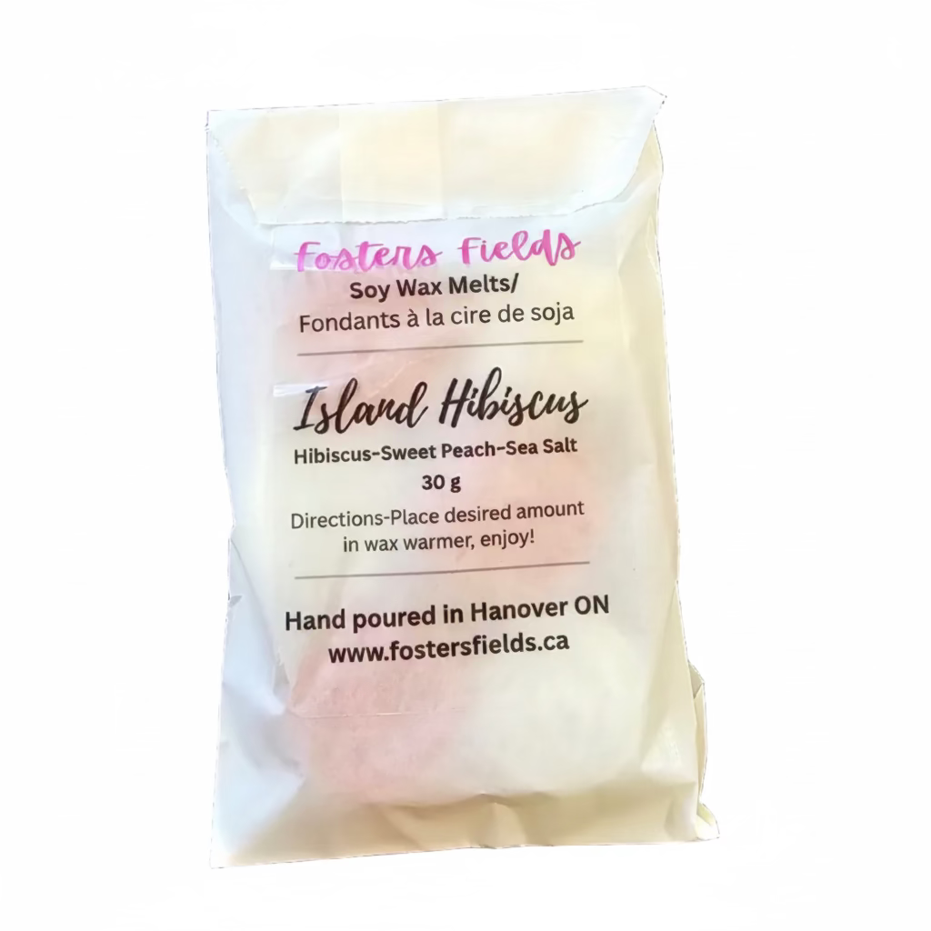 Soy wax melt packet labeled 'Island Hibiscus' on a dark surface