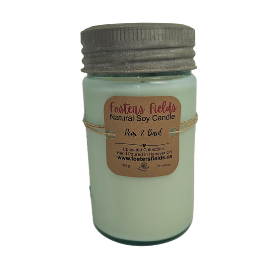 Jar of Foster's Fields natural soy candle with a label on a white background