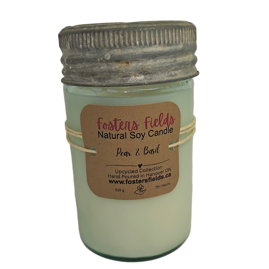 Candle in a glass jar with a metal lid on a white background