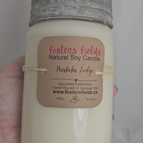 video showcasing a soy jar that is old fashioned with a metal and glass lid. white soy wax