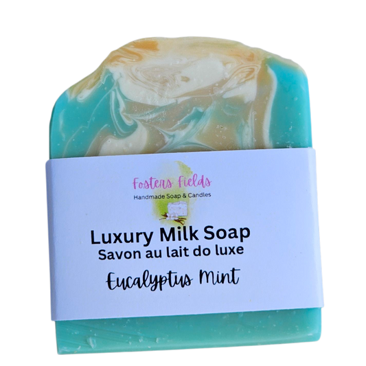 Luxury milk soap bar with a label on a white background, Eucalyptus Mint, handmade soap, green and orange swirls