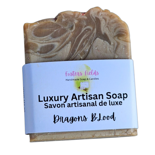 Luxury Artisan Soap with a label on a white background, Dragons Blood, Dark and light browns swirled with white.