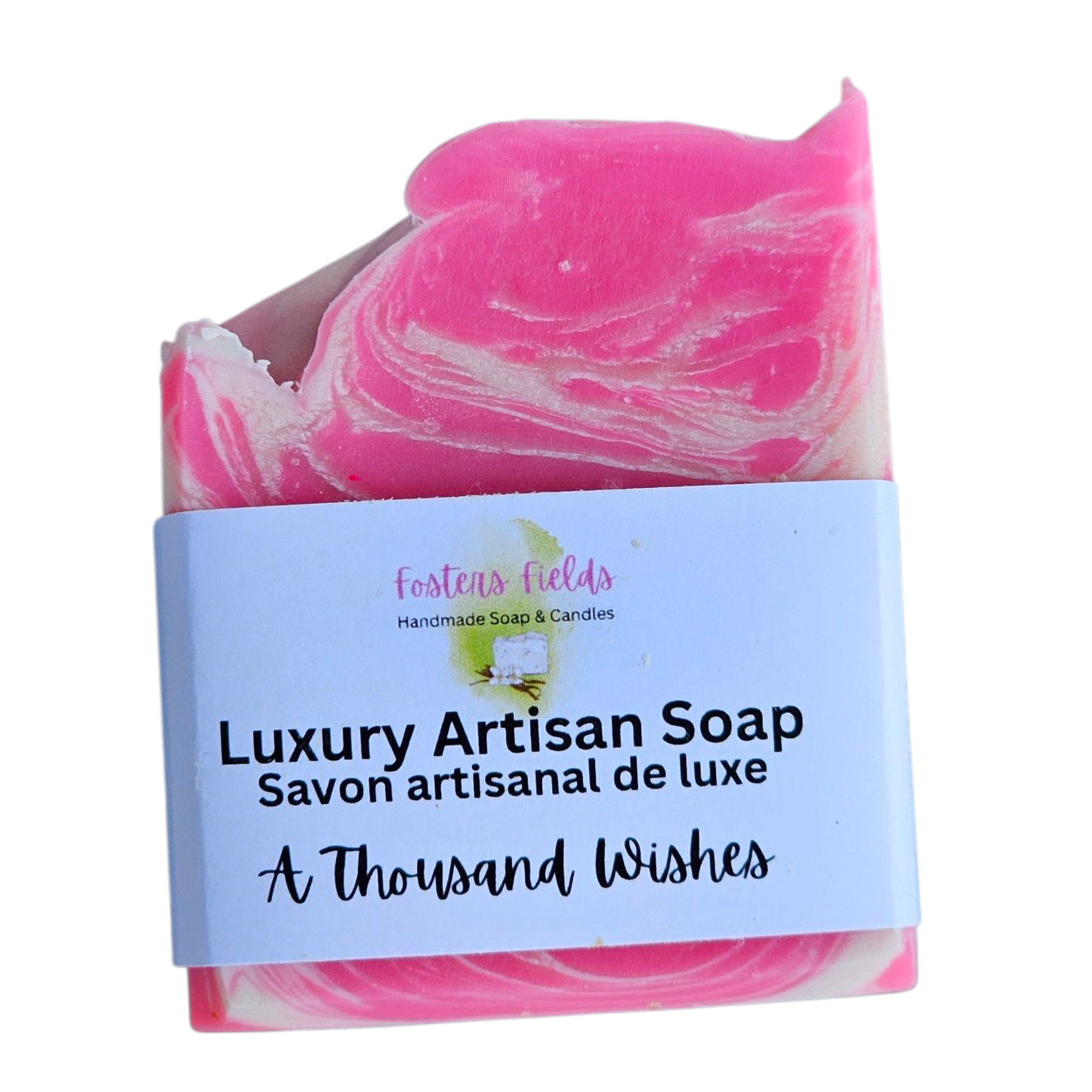 Pink and white marbled soap with a label on a white background, A Thousand Wishes scent, feminine pink and white swirls