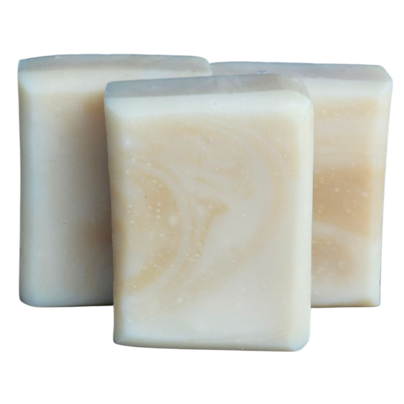 Three rectangular bars of soap on a white background, facial soap, calendula milk gently handmade bar soap