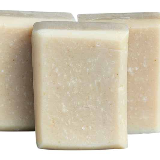 Three square bars of soap on a white background, tumeric soap, facial soap, gentle