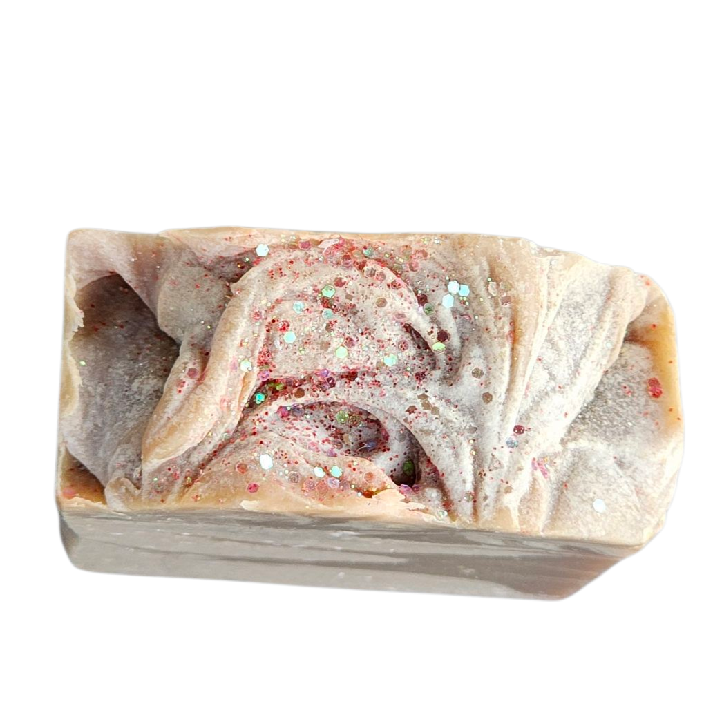Bar of soap with visible texture on a white background, top view handmade soap bar