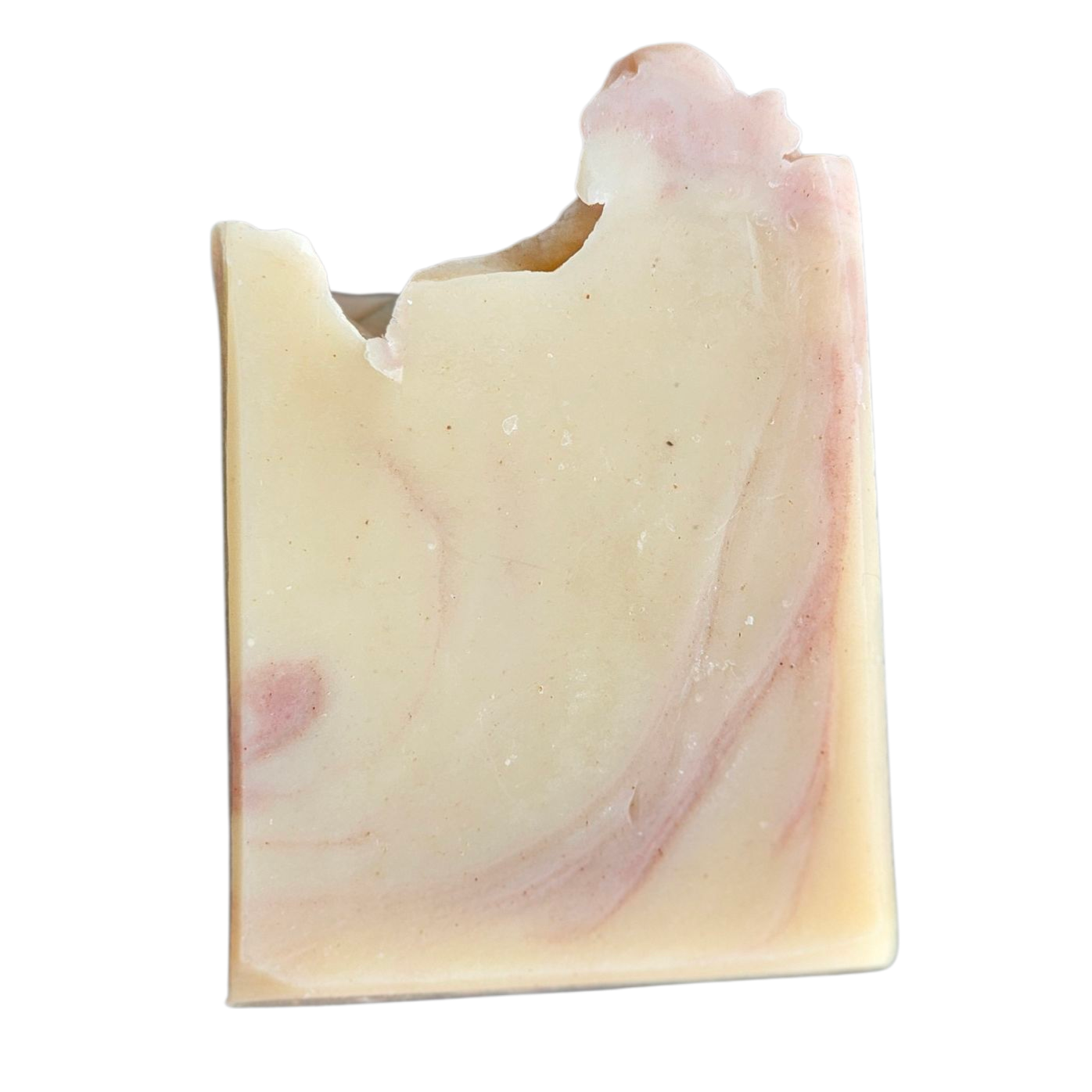 Uniquely shaped soap bar with pink and white swirls on a white background