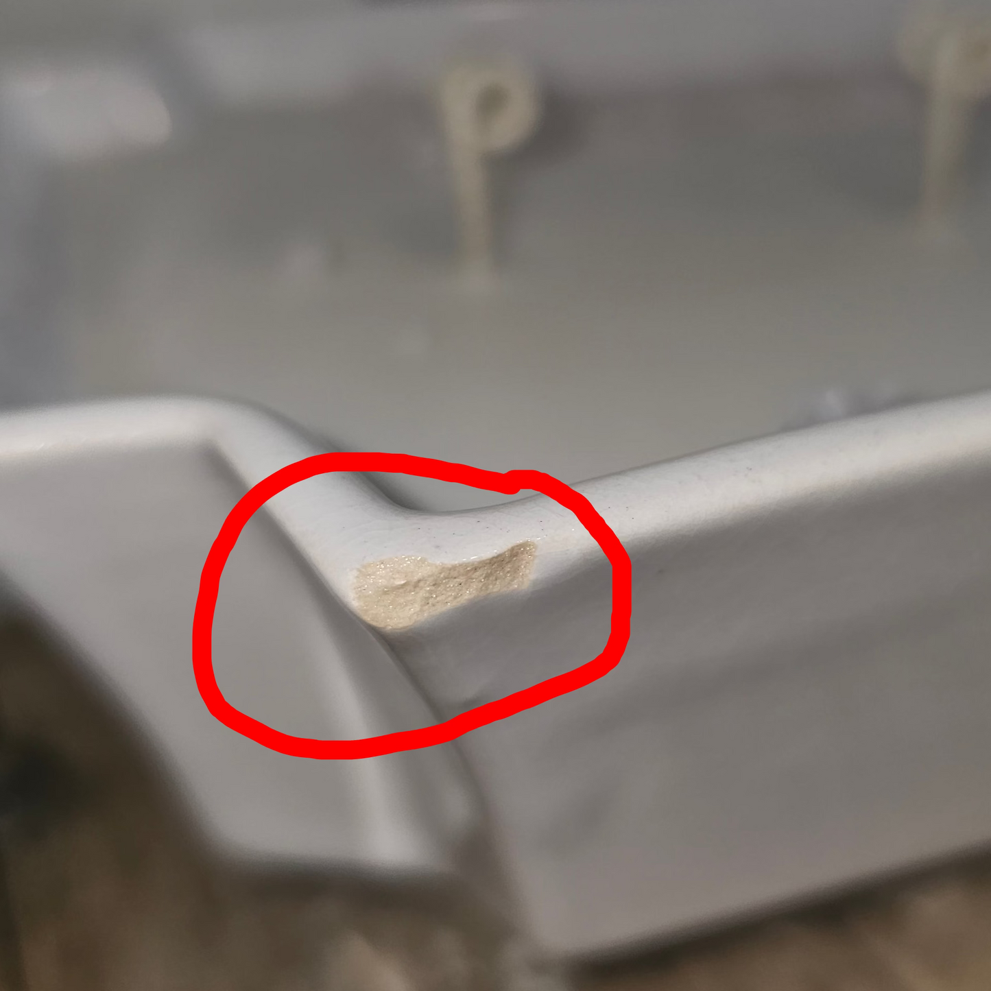 close up image of an imperfection on the upcycled soy candle, the spot is circled as to not miss it
