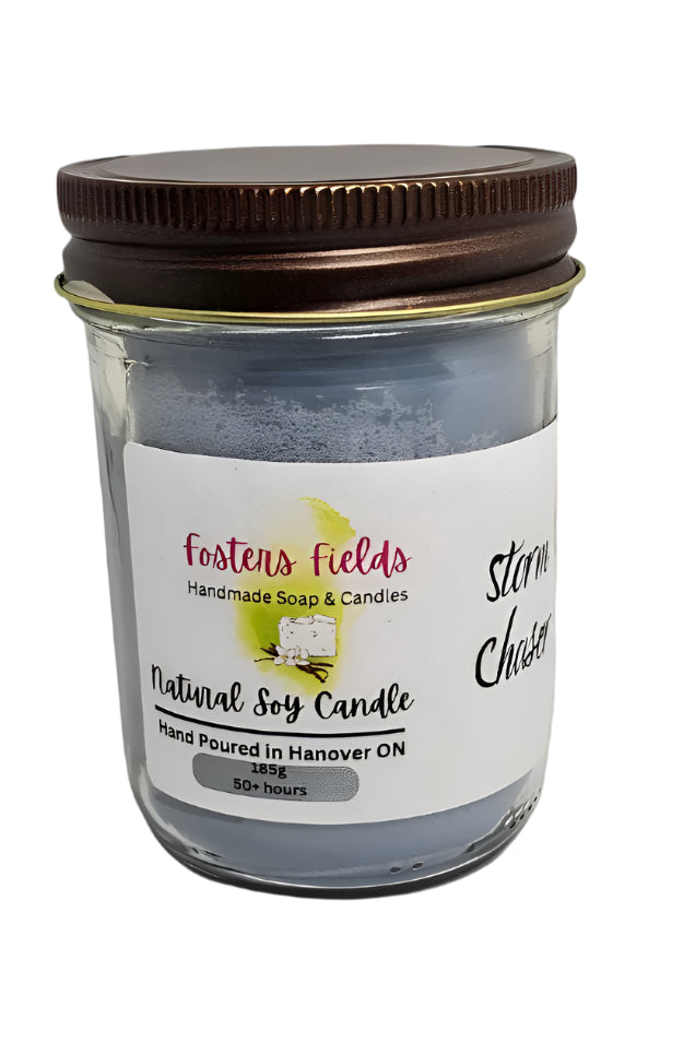 Hand Poured Soy Candle in a masculine scent and colored in blue. 8 oz glass jar